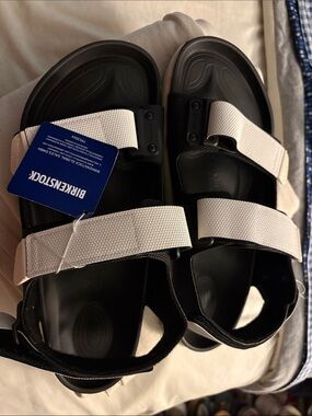Birkenstock Black Sandals with White Straps and Adjustable Buckles